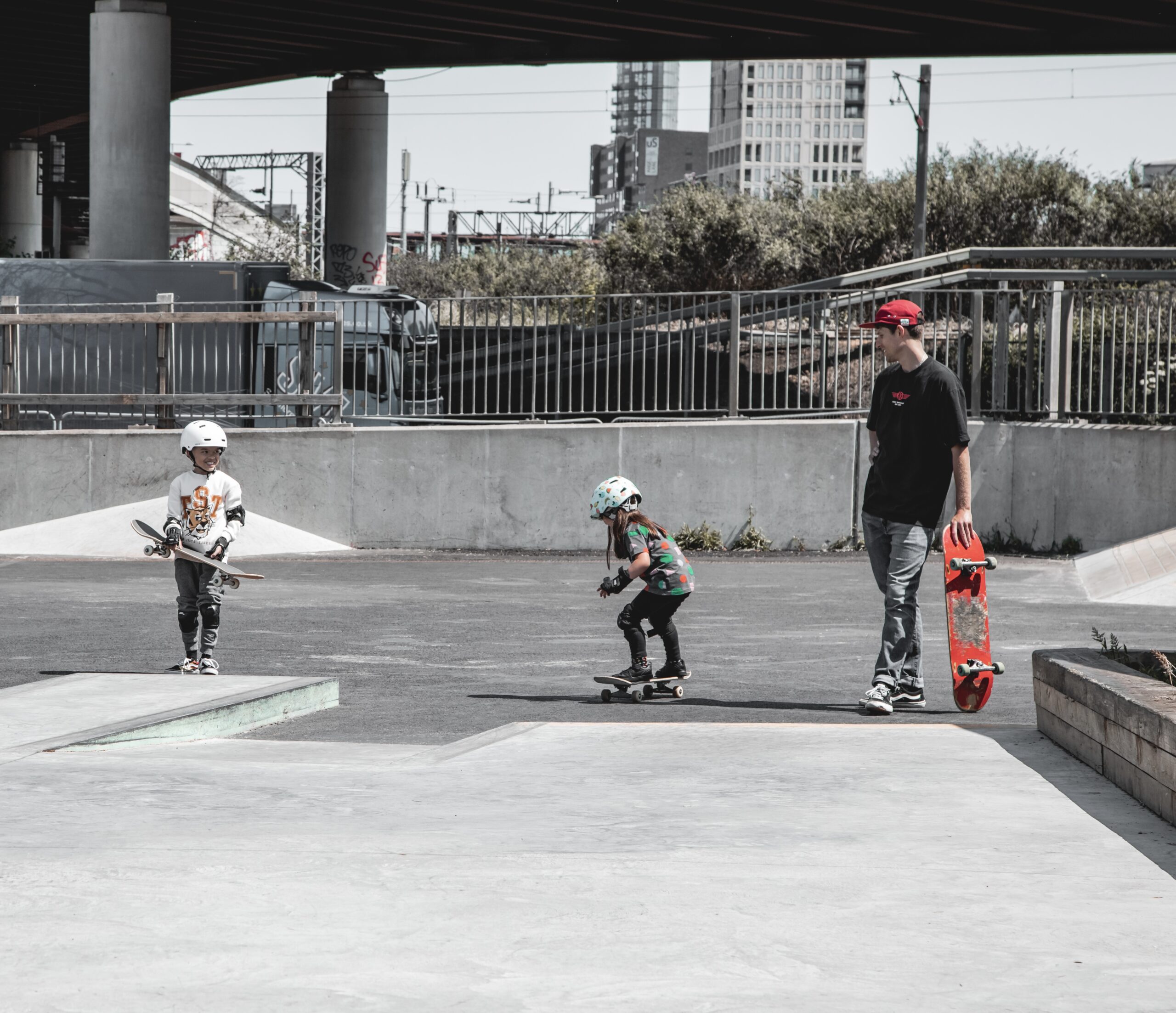 Skate with Jack and 2 children skating in a skate park